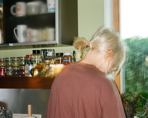 Family preparing a healthy meal together in a bright kitchen